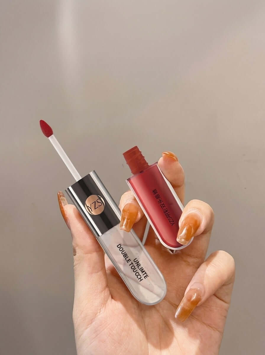 Mirror Finish Lip Gloss – High Shine Hydrating Lip Gloss with two shades in a hand holding the applicator.